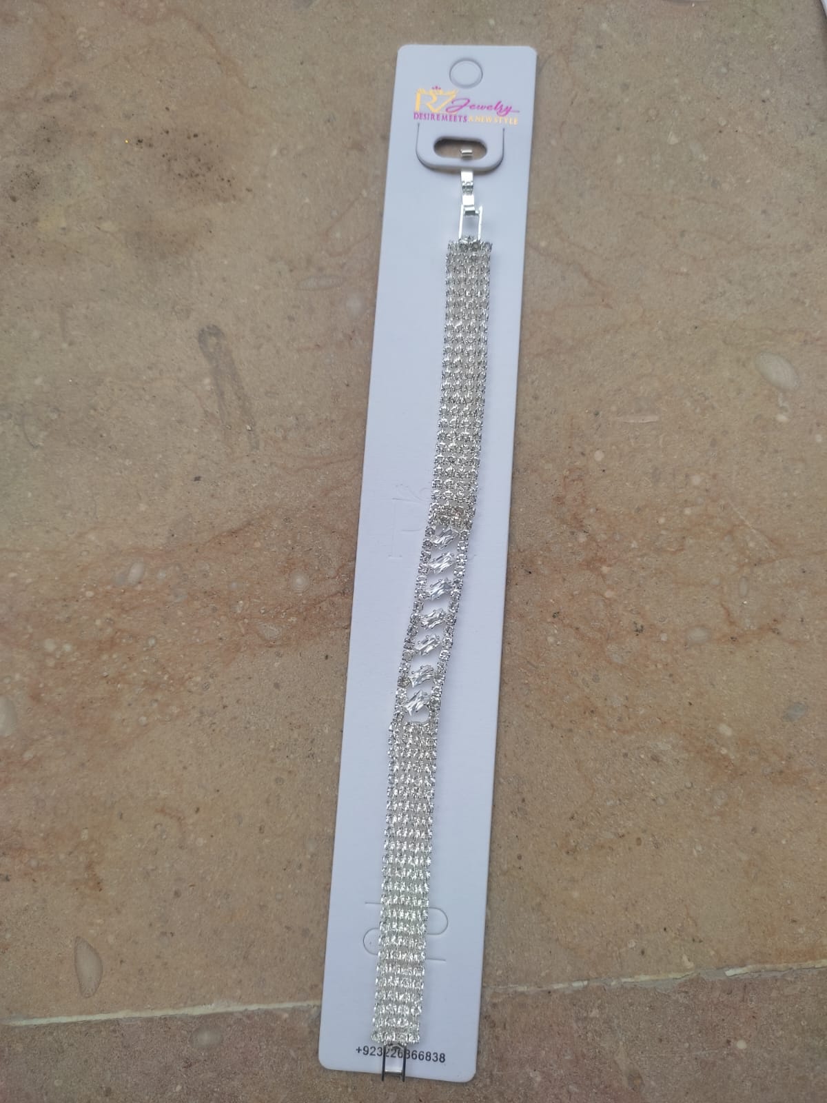 Elegant Silver Rhinestone Bracelet with Diamond-Cut Detailing